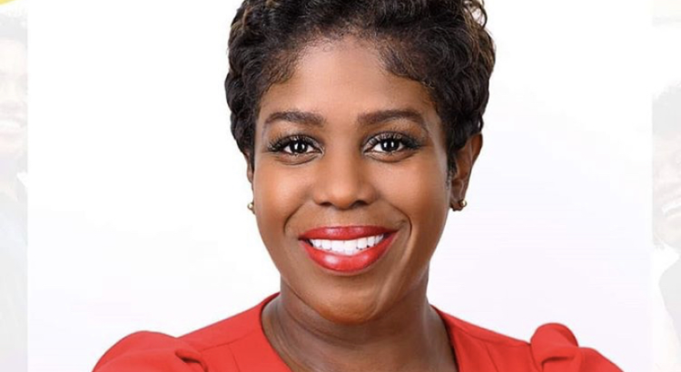 Portrait of April Martindale, Esq., smiling professionally.
