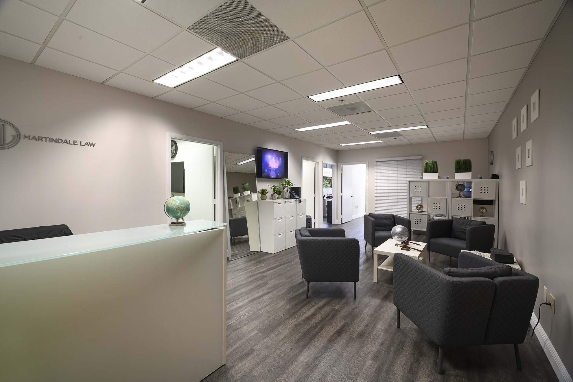 Modern office lobby with seating and decor.